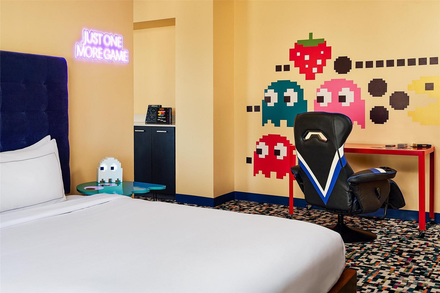 A stylish modern hotel room at The Curtis Denver with colorful pop culture decorations