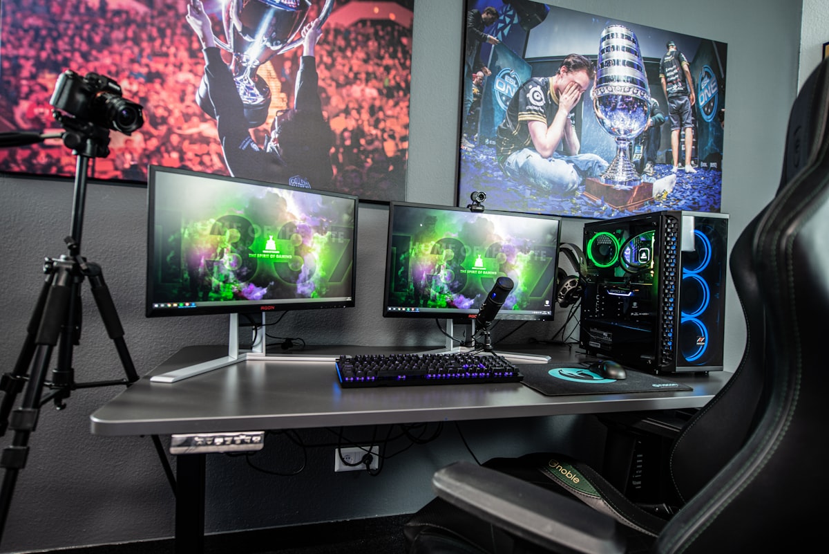 Players at a Korean PC Bang gaming station with high-performance computers and LED lights
